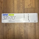 Hang Onn. Metal Tabletop Stand For 37" 70" Tvs, Holds Up 110 Lbs, Black. Fixed Price $34.99.